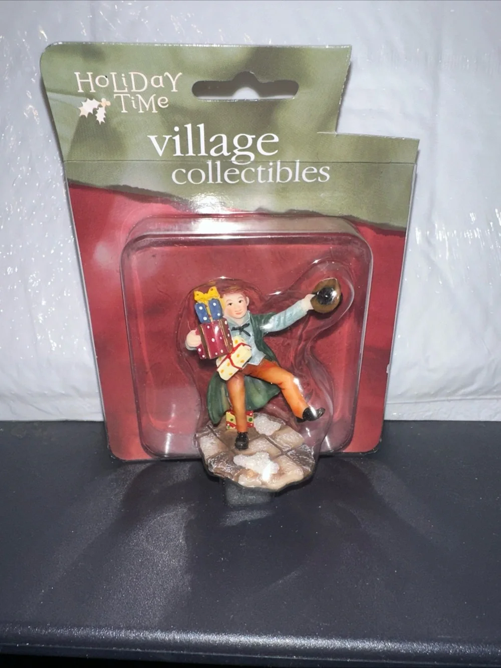 Holiday Time Figurine - Green Coat, Orange Pants, Red and Blue Gifts